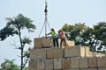 Construction workers stacking the maintain load test block at the construction site Royalty Free Stock Photo